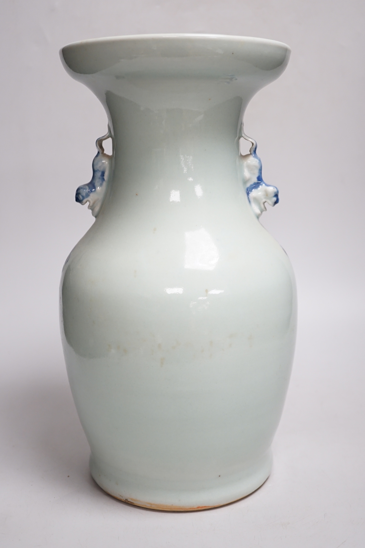 A Chinese celadon ground underglaze blue baluster vase, early 20th century, 34cm
